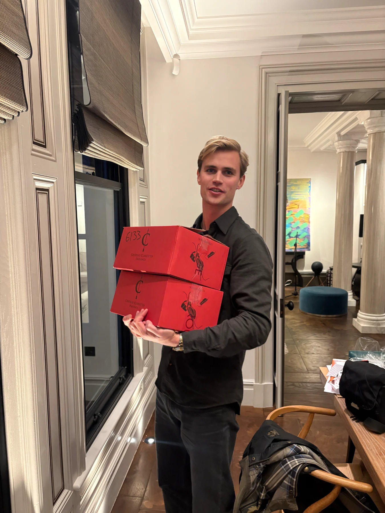 Preparing for the Knightsbridge art salon with two cases of Château Clairettes wine.